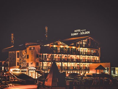Sunny holiday in Sölden, Austria Illuminated Hotel Sunny in Sölden at night